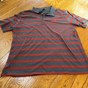 Oakley polo gray and orange striped shirt. Size Large.
